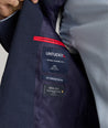 Model is wearing UNTUCKit Beasley sport coat in navy.