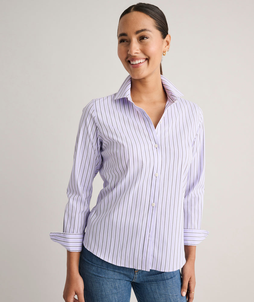 Model is wearing UNTUCKit Wrinkle- Free Cotton Stretch Bella Shirt in purple strip.