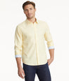 Model is wearing UNTUCKit Wrinkle-Free Burke Shirt in Textured Light Yellow.
