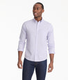 Model is wearing UNTUCKit Lilac Gingham Wrinkle-Free Cadetto Shirt.