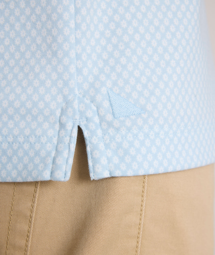 Model is wearing UNTUCKit Chen wrinkle free polo in blue.