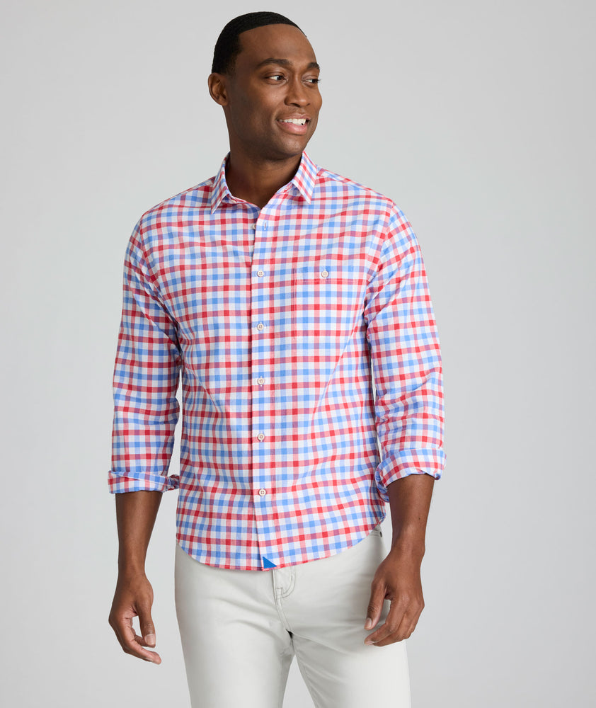 Model is wearing UNTUCKit Clarkson cotton linen shirt in red.