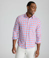 Model is wearing UNTUCKit Clarkson cotton linen shirt in red.