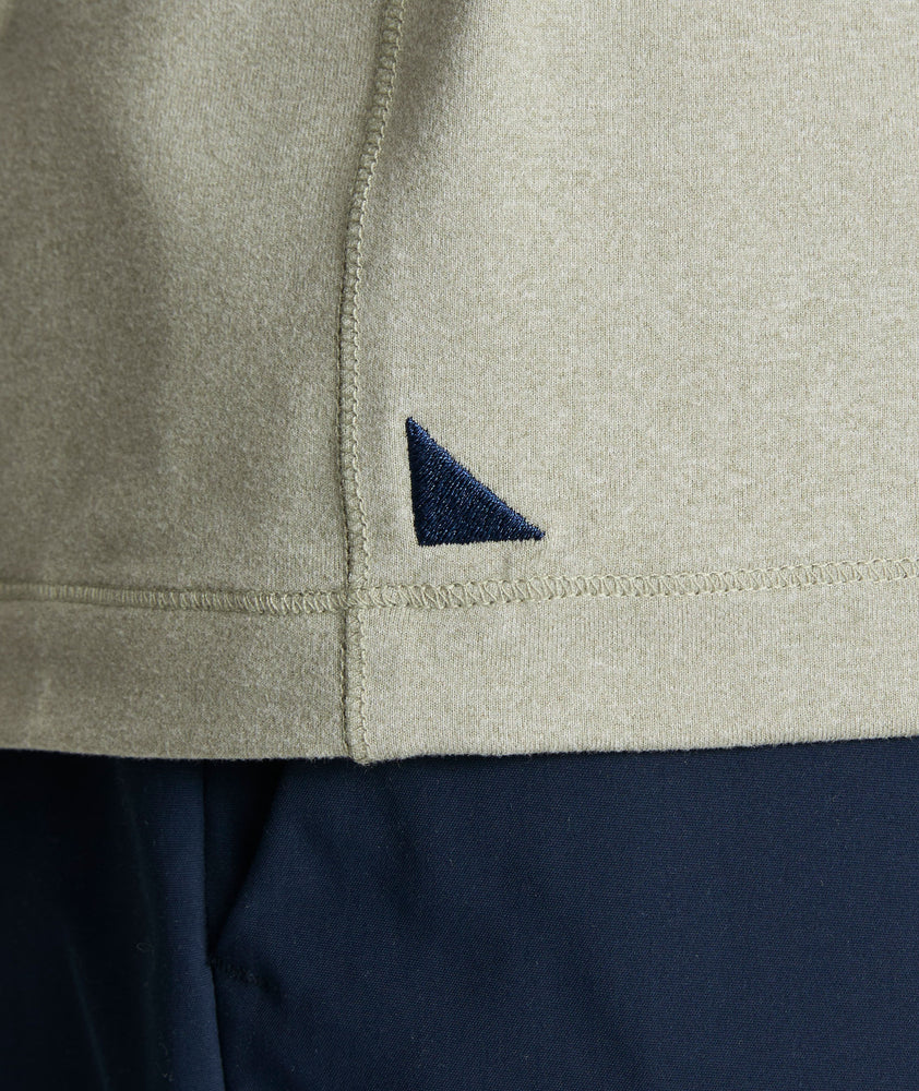 Model is wearing UNTUCKit Clavidor performance polo in shadow.