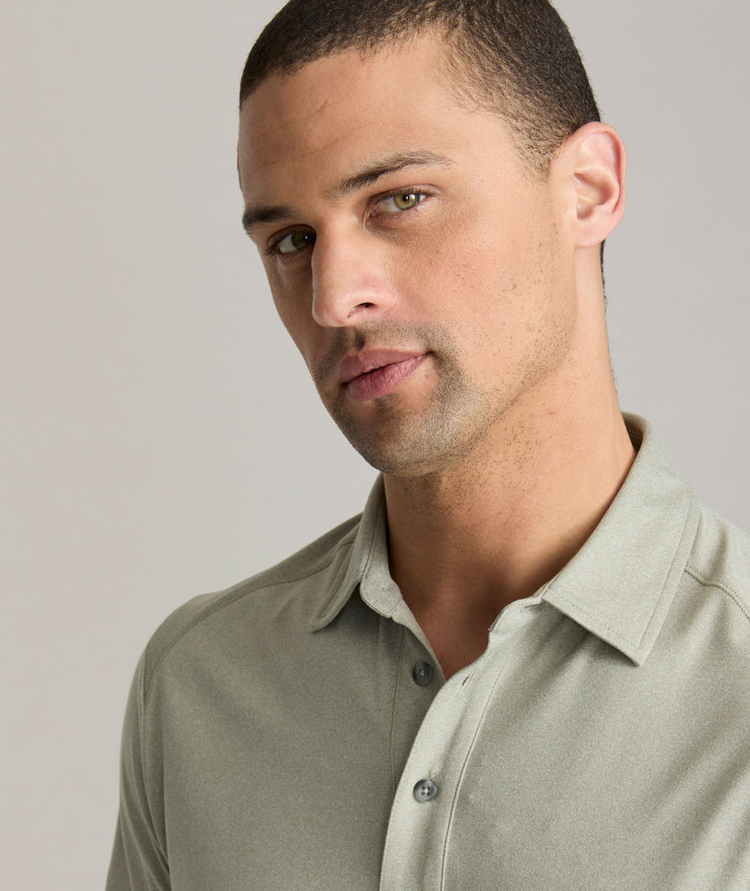 Model is wearing UNTUCKit Clavidor performance polo in shadow.