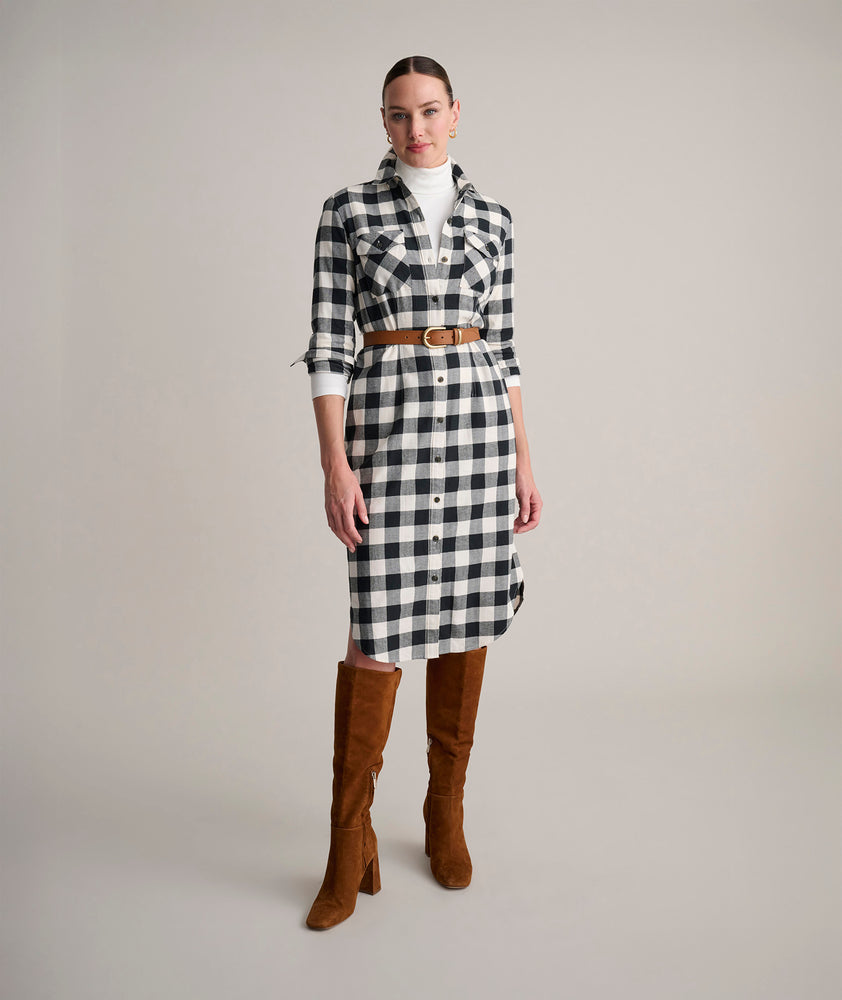 Model is wearing UNTUCKit Colby dress in buffalo check.