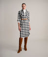 Model is wearing UNTUCKit Colby dress in buffalo check.