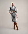 Model is wearing UNTUCKit Colby dress in buffalo check.