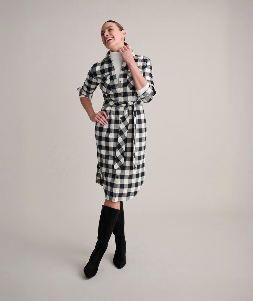 Model is wearing UNTUCKit Colby dress in buffalo check.