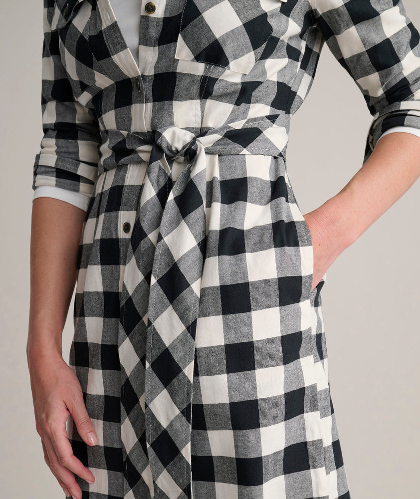 Model is wearing UNTUCKit Colby dress in buffalo check.