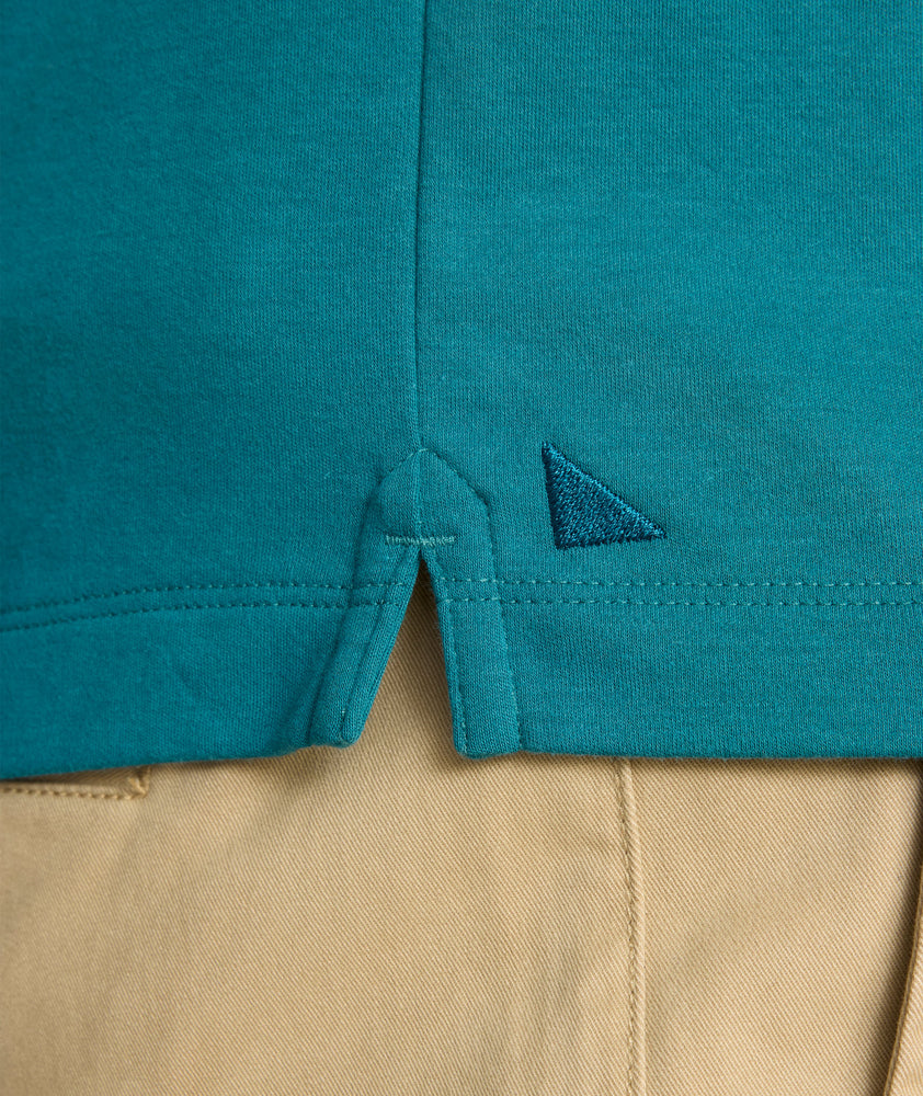 Model is wearing UNTUCKit Long Sleeve Damaschino in Dragonfly Teal.