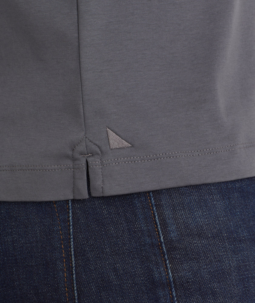 Model is wearing UNTUCKit Wrinkle-Free Long-Sleeve Damaschino Polo in Slate Gray With Contrast Placket.