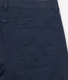 Model is wearing UNTUCKit 5-Pocket Chino Pants in navy.
