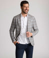 Model is wearing UNTUCKit France sport coat in gray.