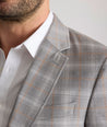 Model is wearing UNTUCKit France sport coat in gray.