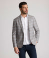 Model is wearing UNTUCKit France sport coat in gray.