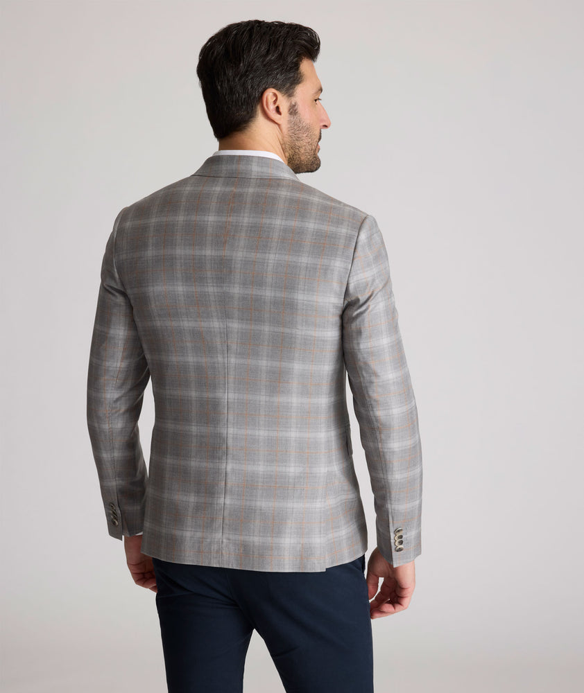 Model is wearing UNTUCKit France sport coat in gray.
