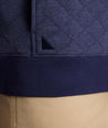 Model is wearing UNTUCKit Garrison pullover in blue.