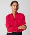 Model is wearing UNTUCKit Gloria shirt in red.