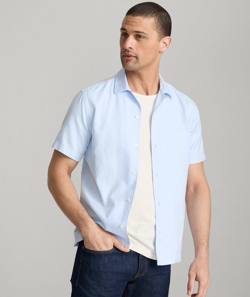 Model is wearing UNTUCKit Hughes in light blue.