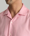 Model is wearing UNTUCKit Hughes in light red.