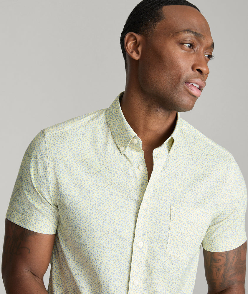 Model is wearing UNTUCKit Ivers performance shirt in yellow.