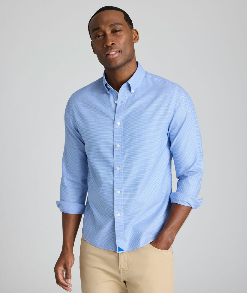 Model is wearing UNTUCKit Jamison wrinkle-free blue print long sleeve.