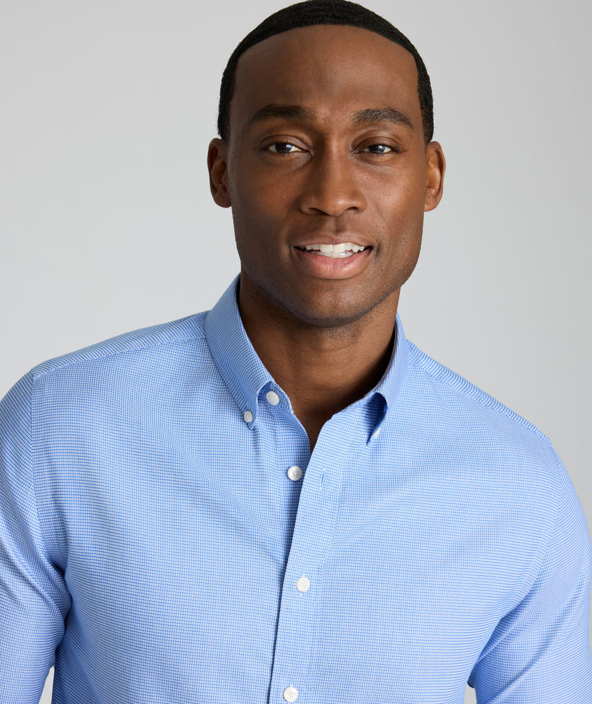 Model is wearing UNTUCKit Jamison wrinkle-free blue print long sleeve.
