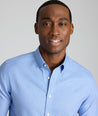 Model is wearing UNTUCKit Jamison wrinkle-free blue print long sleeve.