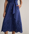 Model is wearing UNTUCKit Cotton Stretch Navy Eyelet Lillian Midi Shirtdress.