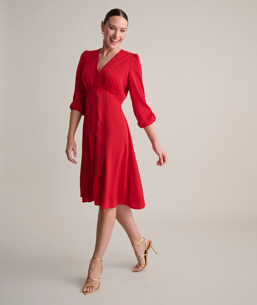 Model is wearing UNTUCKit Malorie dress in red.