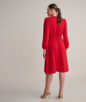Model is wearing UNTUCKit Malorie dress in red.