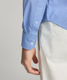 Model is wearing Marlowe performance shirt.