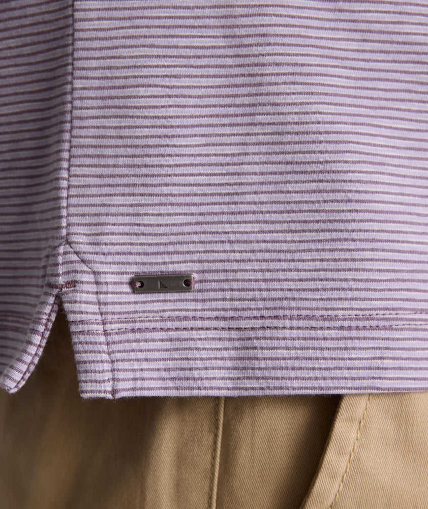 Model is wearing UNTUCKit Martinez Stripe Polo in Montana Grape.