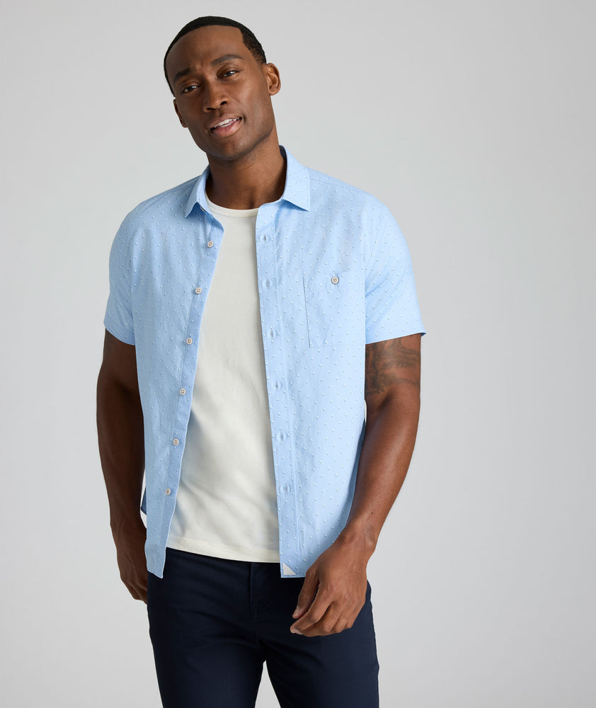 Model is wearing UNTUCKit Quinn cotton linen top in blue print.