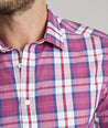 Model is wearing UNTUCKit rafferty shirt in plaid red.