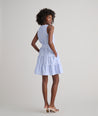 Model is wearing UNTUCKit Roxanne blue stripped dress.