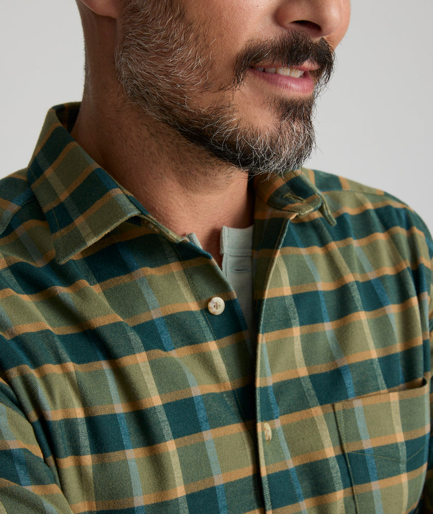 Model is wearing UNTUCKit Ryan performance shirt in green.