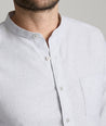 Model is wearing UNTUCKit Sanders shirt is alloy.