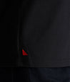 Model is wearing UNTUCKit Saxum ultra soft tee in black.