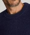 Model is wearing UNTUCKit Seaver Crewneck in Evening Blue.