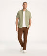 Model is wearing UNTUCKit Classic Chino Pants in brown desert palm - full body