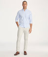 Model is wearing UNTUCKit Classic Chino Pants in Stone Gray - full body