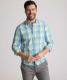 Model is wearing UNTUCKit Stratford vintage wash in plaid yellow.