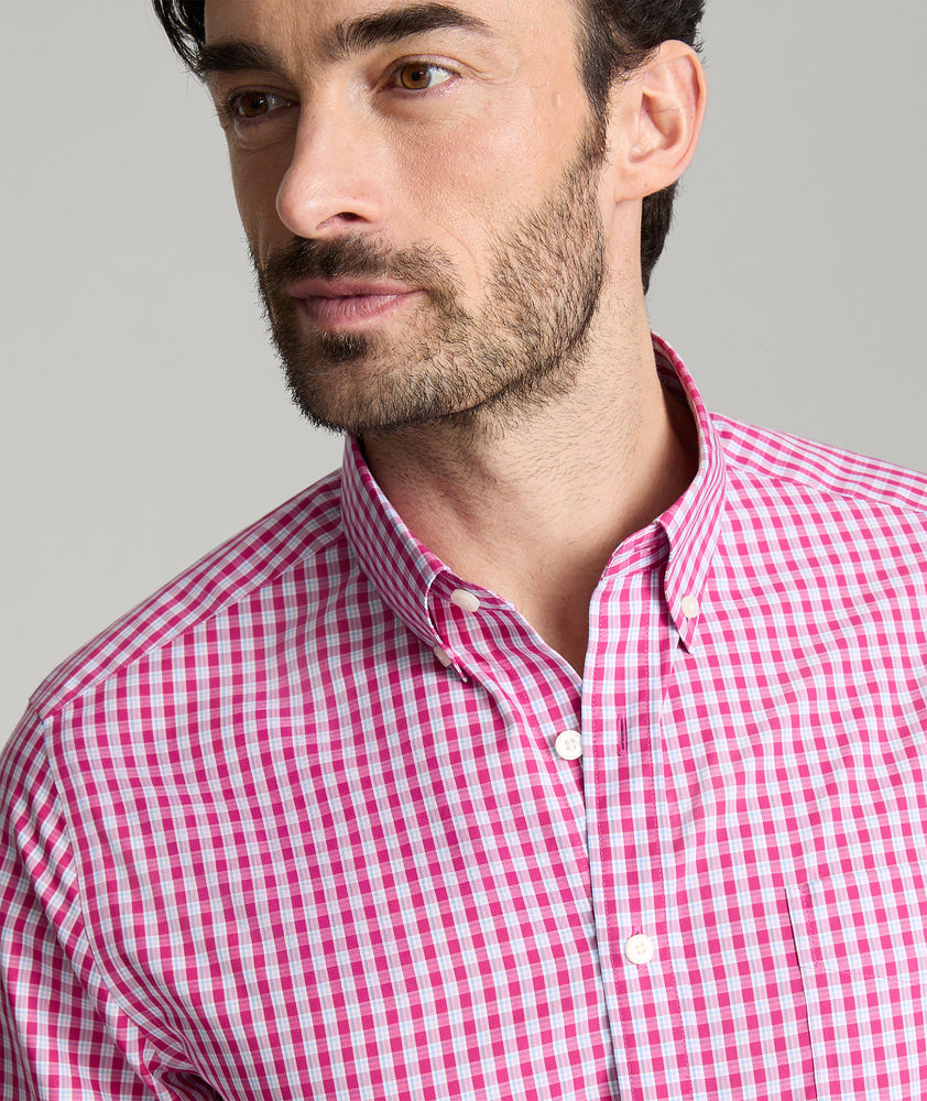 Model is wearing UNTUCKit Thorton wrinkle-free shirt in red.
