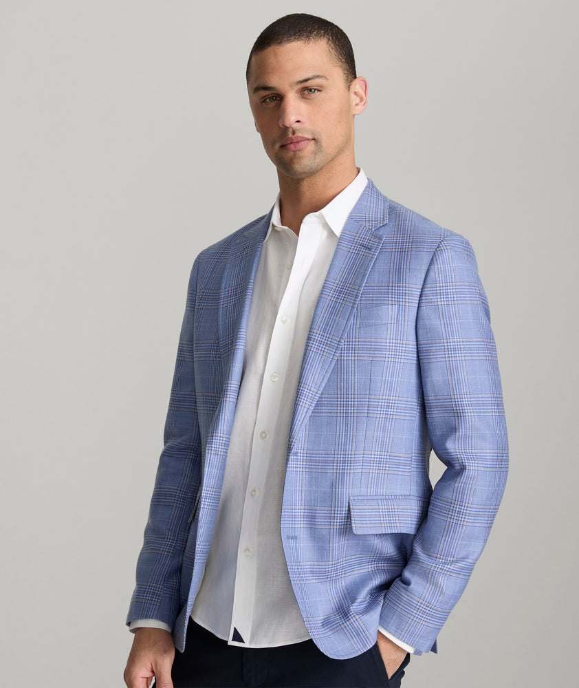 Model is wearing UNTUCKIt Vasquez blue sports coat.