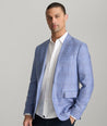 Model is wearing UNTUCKIt Vasquez blue sports coat.