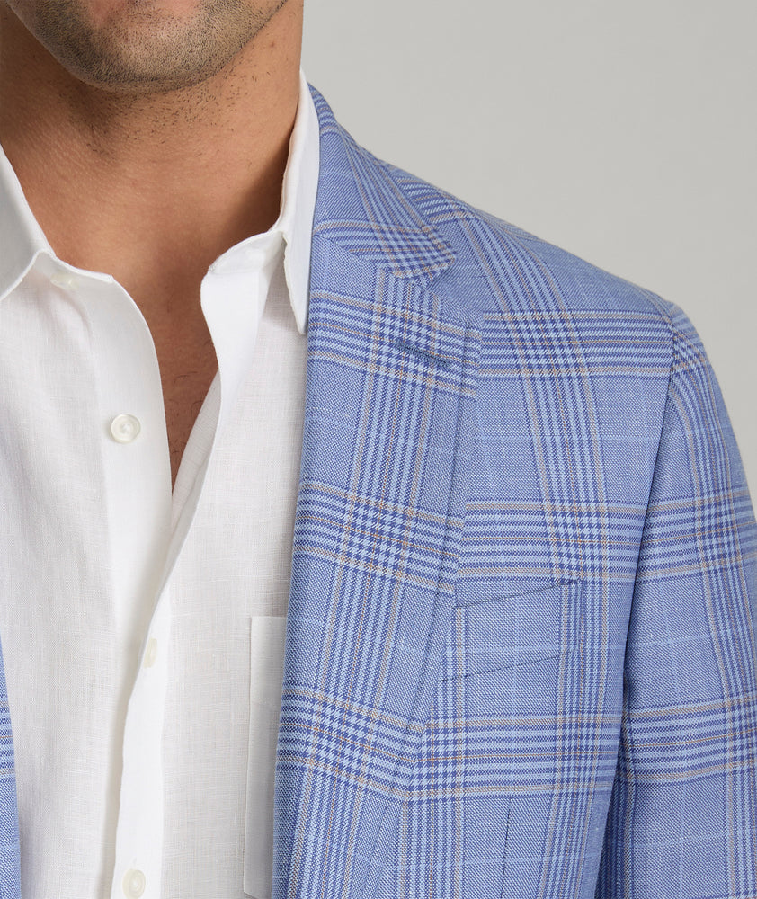 Model is wearing UNTUCKIt Vasquez blue sports coat.