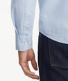Model is wearing UNTUCKit Garment Dyed Cotton Pique Shirt in light blue.