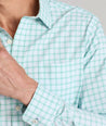 Model is wearing UNTUCKit Wells in light blue and green check.